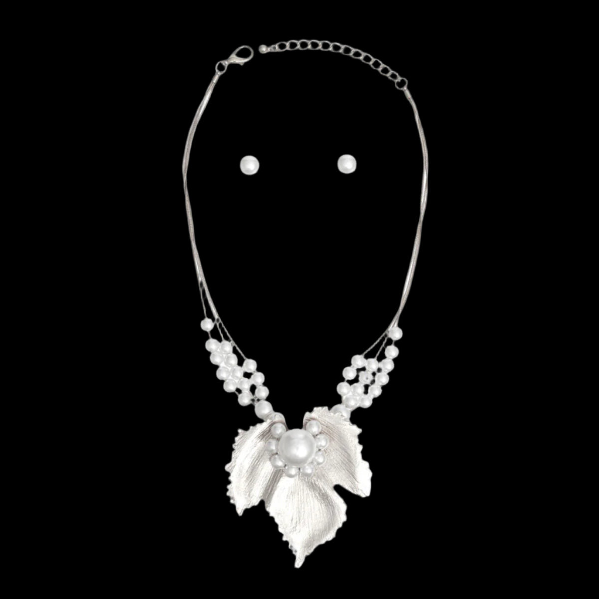 Women's Pendant Necklace Set 3 Strand Elegant Silver Metal Snake Chain Necklace Featuring White Pearl Slides and Textured Metal Leaf Pendant with Pearls. Pendant measures 3.25" x 3.25". Lobster Clasp Closure. Includes Matching Pearl Ball Stud Post Backing Earrings.